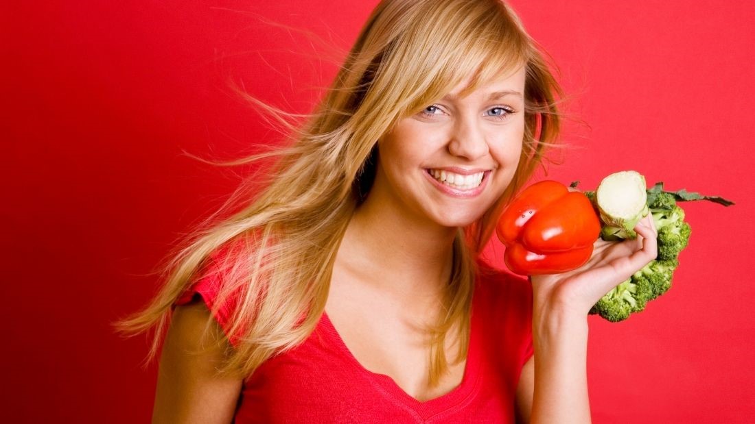 Happy woman with veg